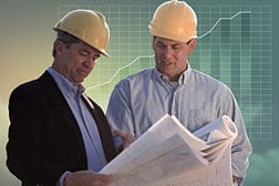 construction men reading plans