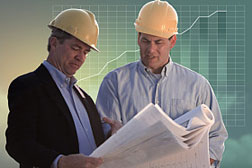 construction men reading plans
