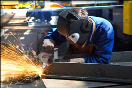 Welder working on steel fabrication